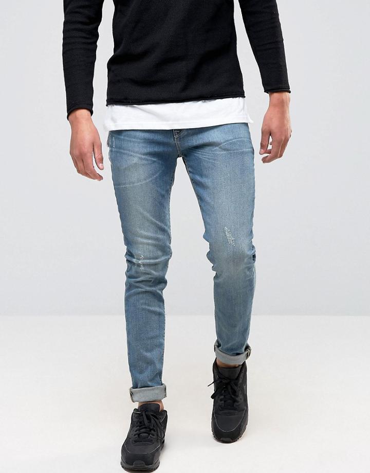 Asos Skinny Jeans In Mid Wash Blue - Blue