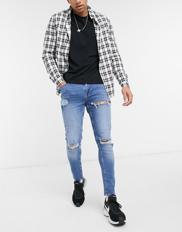 Asos Design Skinny Jeans In Mid Wash Blue With Heavy Rips-blues