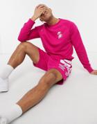 Nike World Tour Pack Graphic Crew Neck Sweatshirt In Pink