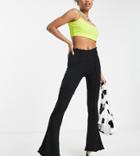 Topshop Petite Patchwork Seam Flared Pants With Ruffle Detail In Black