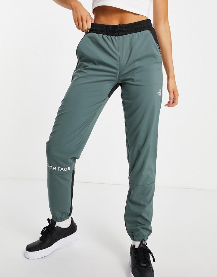 The North Face Training Mountain Athletic Wind Sweatpants In Green