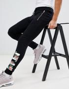 Asos Design Super Skinny Joggers With Rose Gold Zip Pockets And Floral Print - Black