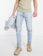Asos Design Skinny Jeans In Light Wash Blue With Knee Rips