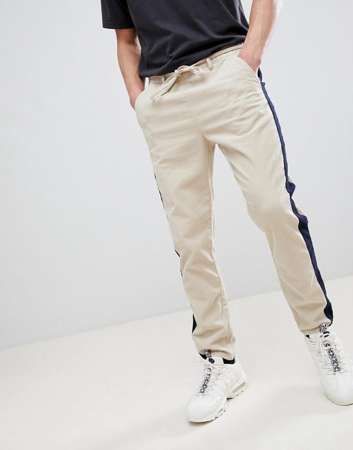 Asos Design Tapered Pants In Putty Cord With Navy Side Stripe - Beige