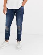 Asos Design Slim Jean In Blue Black With Busted Knee