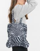 Asos Design Shopper With Ruffle In Zebra Print-black