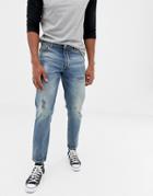 Asos Design 14oz Heavy Weight Tapered Jeans In Mid Wash Blue With Rips