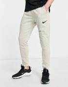 Nike Training Dri-fit Swoosh Tapered Cuffed Sweatpants In Stone-gray
