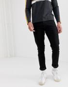 Wrangler Larston Slim Tapered Fit Jeans In Black Valley Rinse Wash