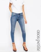 Asos Petite Whitby Low Rise Skinny Jeans In Tasmin Mid Blue Wash With Abrasion Pocket Detail - Mid Stone Wash