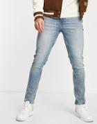 Asos Design Cone Mill Denim Skinny Fit 'american Classic' Jeans In Tinted Mid Wash-blue