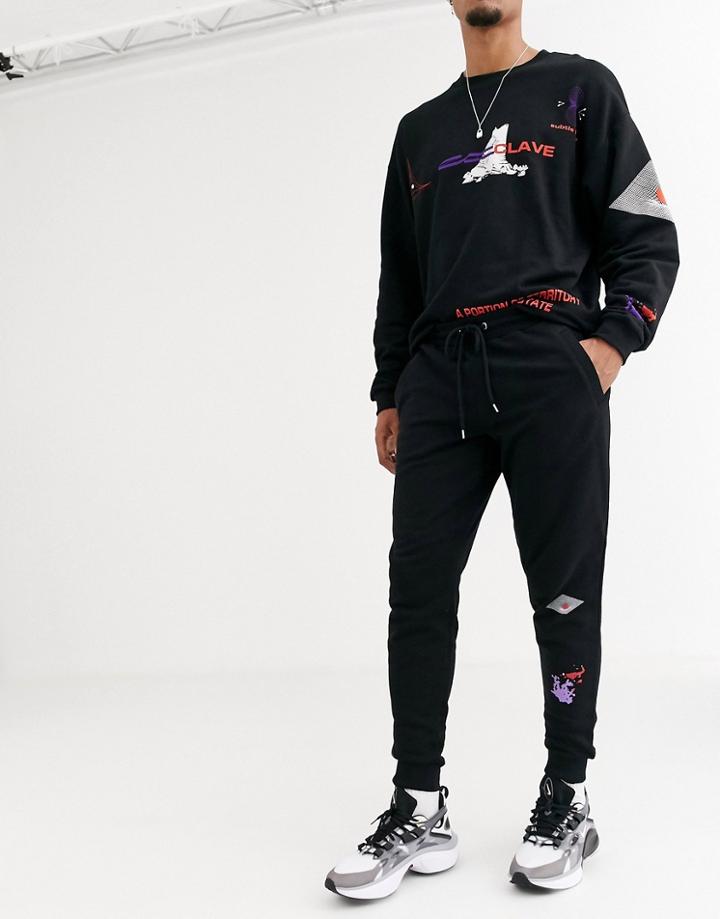 Asos Design Two-piece Tapered Jogger In Black With Multi Print Placements
