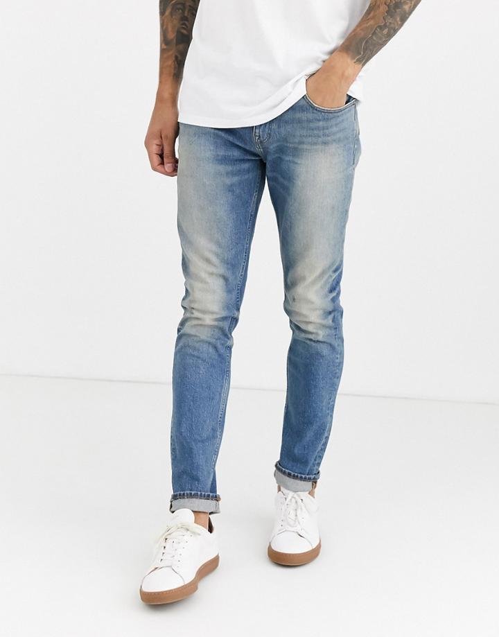 Asos Design Cone Mill Denim Skinny 'american Classic' Jeans In Vintage Mid Wash Blue With Heavy Wash