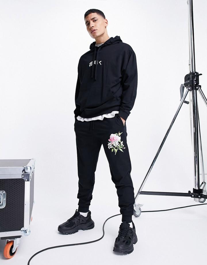 Asos Design Organic Blend Lightweight Slim Joggers In Black With Floral Print - Part Of A Set
