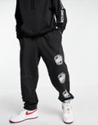 Tommy Jeans World Peace Print Sweatpants In Black