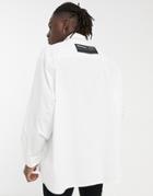 Asos Unrvlld Spply Super Oversized White Poplin Shirt With Rubberized Badge Logo
