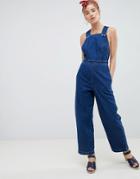 Asos Design Denim Cross Back Jumpsuit In Blue With Popper Detail - Blue