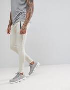 Asos Super Skinny Joggers With Zip Pockets In Beige - Beige