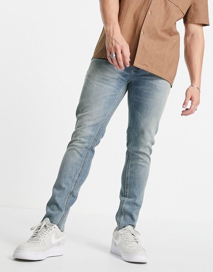 Asos Design Cone Mill Denim Skinny Fit 'american Classic' Jeans In Vintage Mid Wash With Raw Hem-blues