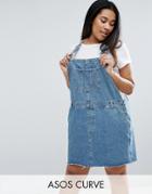 Asos Curve Denim Overall Dress In Mid Wash Blue - Blue