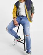 Asos Design Skinny Jeans In Mid Wash With Heavy Rips-blues