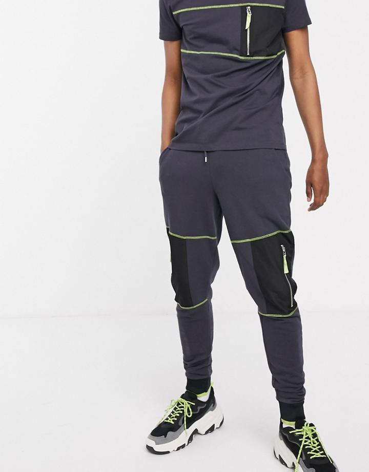 Asos Design Two-piece Skinny Sweatpants With Contrast Stitching And Zip Utility Pockets In Washed Black