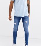 Asos Design Tall Spray On Jeans With Power Stretch In Mid Wash Blue With Abrasions