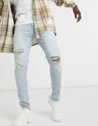 Asos Design Skinny Jeans In Vintage Light Wash With Rips-blues