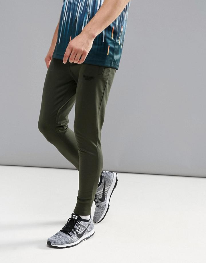 Muscle Monkey Skinny Joggers In Khaki With Logo - Green