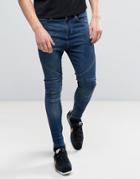 Religion Drop Crotch Skinny Jeans With Biker Knee Detail And Zip Ankle In Dark Wash Blue - Blue