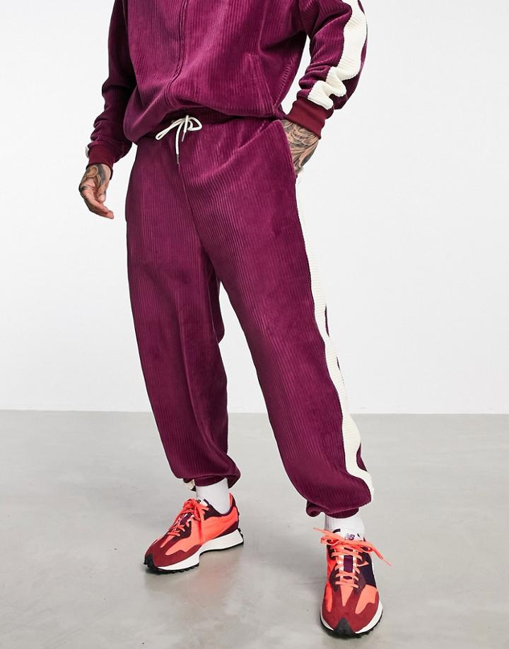 Asos Design Set Oversized Sweatpants In Burgundy Ribbed Velour With Side Stripe-red