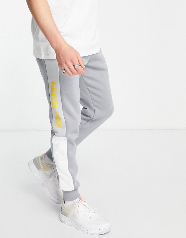 Nike Air Paneled Cuffed Fleece Sweatpants In Gray
