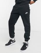 Nike Club Essentials Reflective Logo Cuffed Sweatpants In Black