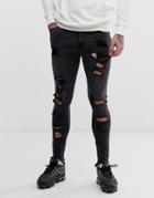 Asos Design Spray On Jeans In Power Stretch With Raw Hem And Heavy Rips In Washed Black - Black