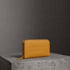 Burberry Burberry Embossed Leather Ziparound Wallet, Yellow