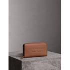 Burberry Burberry Embossed Leather Ziparound Wallet, Brown