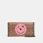 Coach Callie Foldover Chain Clutch In Signature Canvas With Rexy By Yeti Out