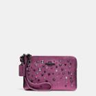 Coach Small Wristlet In Metallic Leather With Star Rivets