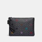 Coach Large Wristlet 30 In Signature Canvas With Star Applique And Snakeskin Detail