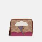 Coach Small Zip Around Wallet In Signature Canvas With Lightning Cloud Applique And Snakeskin Detail