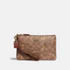 Coach Small Wristlet In Signature Canvas With Floral Bow Print
