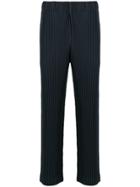 Homme Plissé Issey Miyake Ribbed Style Trousers - Blue