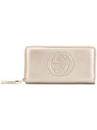 Gucci Embroidered Gg Logo Wallet - Gold