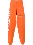 Heron Preston Logo Print Track Pants - Yellow & Orange
