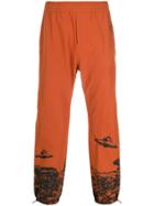 Undercover Elasticated Ufo Print Track Pants - Orange