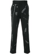 Alexander Mcqueen Safety Pin Print Trousers - Black