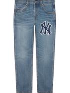 Gucci Tapered Denim Pants With Symbols - Blue