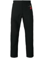 Alexander Mcqueen Swallow Print Tapered Trousers - Black