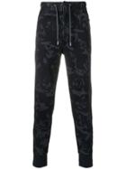 Alexander Mcqueen Camouflage Print Trousers - Blue