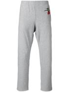 Alexander Mcqueen Swallow Print Tapered Trousers - Grey